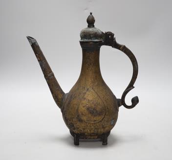 An Indian Islamic brass ewer, 27cm high